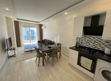 Furnished apartment 1 + 1, with an area of 65m² in a new residence in Mahmutlar ID-8144 фото-2
