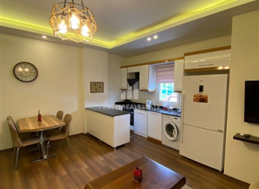 Furnished two-bedroom apartment 150 meters from the sea on the main street of Mahmutlar ID-8170 фото-2