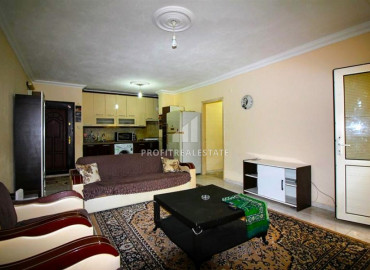 Inexpensive two-bedroom apartment 450m from the sea, in an urban-type building in Mahmutlar ID-8200 фото-1