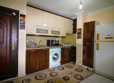 Inexpensive two-bedroom apartment 450m from the sea, in an urban-type building in Mahmutlar ID-8200 фото-2