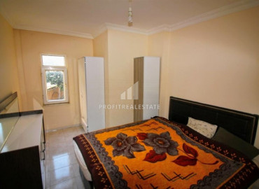 Inexpensive two-bedroom apartment 450m from the sea, in an urban-type building in Mahmutlar ID-8200 фото-4