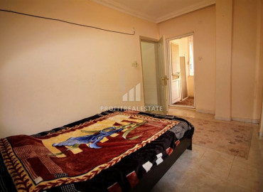 Inexpensive two-bedroom apartment 450m from the sea, in an urban-type building in Mahmutlar ID-8200 фото-6