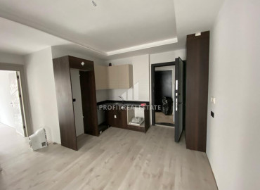 Новые квартиры с одной спальней в 250м от моря в центре Мерсина, район Енишехир ID-8225 фото-2