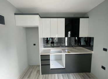 Новая двухкомнатная квартира с отличным расположением в микрорайоне Соли, Мерсин ID-8243 фото-4