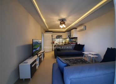 Furnished apartment 1 + 1, 60m² in a residence with facilities in Mahmutlar, 450m from the sea ID-8282 фото-1