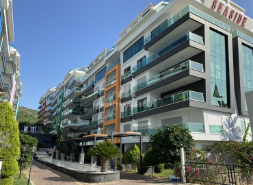 Меблированная трехкомнатная квартира в элитном комплексе с собственным пляжем в Каргыджаке ID-8288 фото-1
