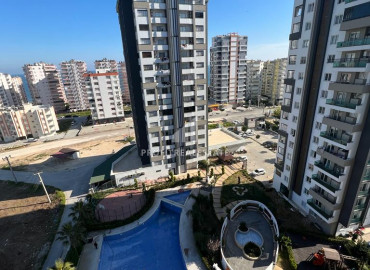New apartment 2 + 1 in a residence with excellent facilities 300 meters from the sea in Mersin - Teje ID-8416 фото-1