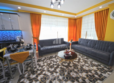 Furnished apartment 2 + 1 in a residence with a swimming pool in the western part of Mahmutlar ID-8480 фото-1