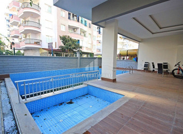 Furnished apartment 2 + 1 in a residence with a swimming pool in the western part of Mahmutlar ID-8480 фото-18