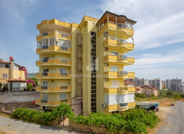 Apartment with two bedrooms, furniture and appliances overlooking the mountains in Mahmutlar ID-8517 фото-1