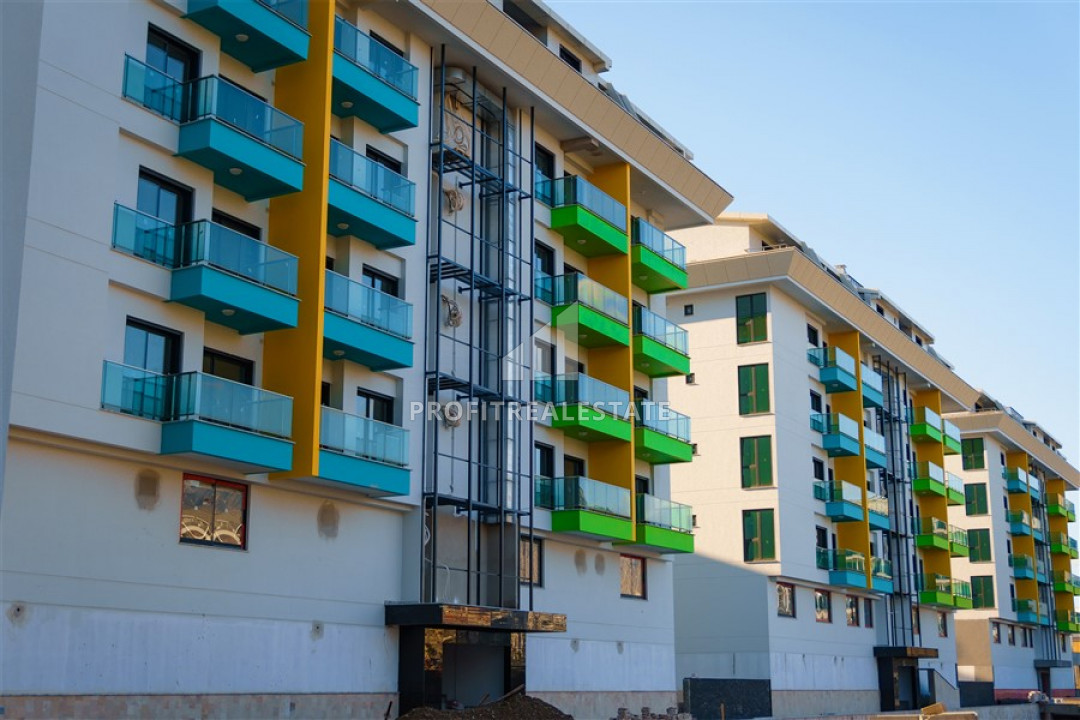 Новая двухкомнатная квартира в резиденции с богатой инфраструктурой, всего в 200 метрах от моря, Каргыджак, Аланья, 55 м2 ID-8540 фото-1