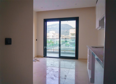 Новая двухкомнатная квартира в резиденции с богатой инфраструктурой, всего в 200 метрах от моря, Каргыджак, Аланья, 55 м2 ID-8540 фото-2