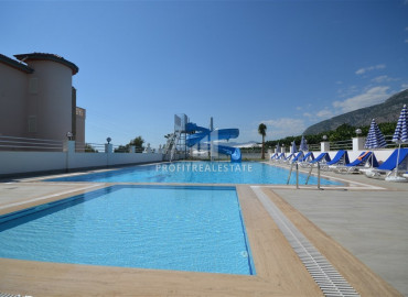 Spacious apartment 2 + 1 in a residence with rich facilities, overlooking the sea and mountains in Mahmutlar ID-8560 фото-1