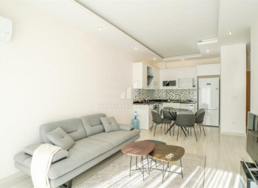 Furnished apartment 1 + 1, with an area of 65m² in a new residence with facilities in Mahmutlar ID-8605 фото-2