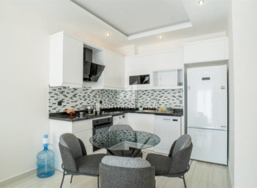 Furnished apartment 1 + 1, with an area of 65m² in a new residence with facilities in Mahmutlar ID-8605 фото-3