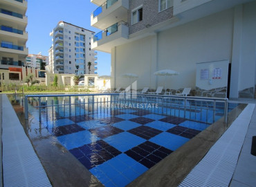 Меблированные апартаменты 2+1 с отдельной кухней в элитной резиденции, в 400м от моря в Махмутларе ID-8610 фото-14