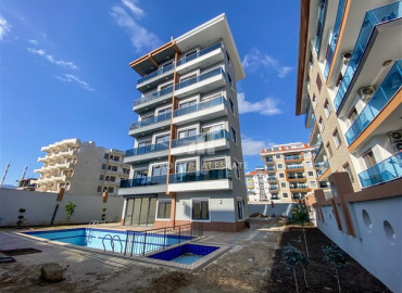 Двухкомнатная квартира в новой резиденции с бассейном в 150м от моря в районе Кестель ID-8627 фото-1