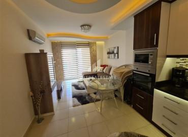 In a luxury residence: ready to move in, 1 + 1 apartment 300m from the sea in Mahmutlar ID-8638 фото-3