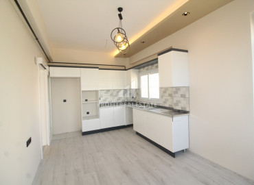 Spacious apartment 3 + 1 in a gasified residence with a swimming pool in the Soli neighborhood, Mezitli ID-8692 фото-1