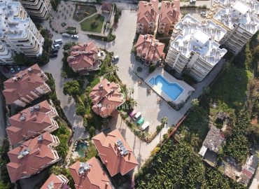 Furnished garden duplex 2 + 1 with a separate kitchen, in a well-maintained residence 600m from the sea in Mahmutlar ID-8699 фото-24