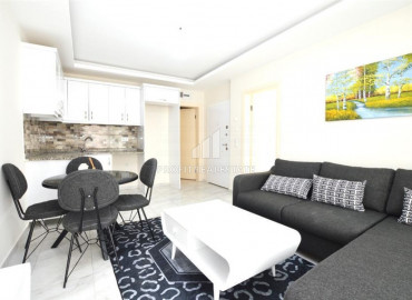 One bedroom furnished apartment in Mahmutlar, Alanya with a large balcony near the sea. ID-8750 фото-2