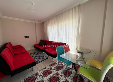 Inexpensive apartment 2 + 1 in an urban-type building near the Tuesday market in Mahmutlar ID-8992 фото-2