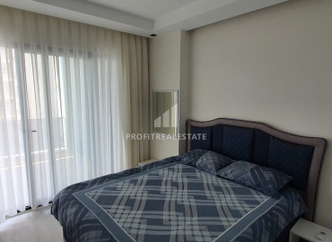 New furnished 1 + 1 apartment with an area of 65m² in a residence with hotel facilities in Mahmutlar ID-8050 фото-21
