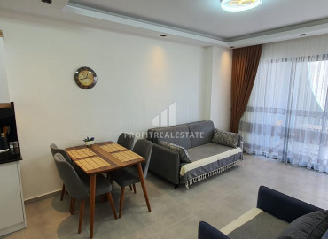 New furnished 1 + 1 apartment with an area of 65m² in a residence with hotel facilities in Mahmutlar ID-8050 фото-23
