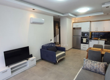 New furnished 1 + 1 apartment with an area of 65m² in a residence with hotel facilities in Mahmutlar ID-8050 фото-24