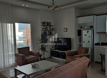 Furnished 2+1 apartment with two bedrooms on the main street of Mahmutlar, 150m from the sea ID-9157 фото-1
