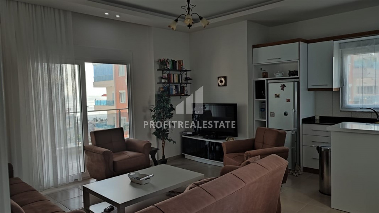 Furnished 2+1 apartment with two bedrooms on the main street of Mahmutlar, 150m from the sea ID-9157 фото-1