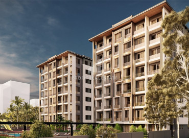 Двух- и трехкомнатные квартиры в строящемся комплексе с хорошей инфраструктурой в Алтынташ, Анталия ID-9198 фото-1