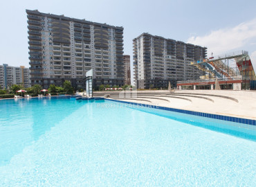 Apartment with two and three bedrooms on different floors in a luxury residence in Cesmeli, Mersin ID-9282 фото-11