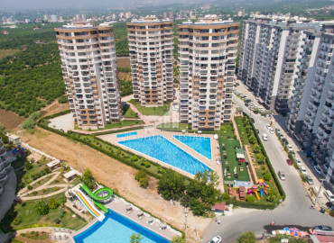 Two bedroom apartment of different sizes on different floors in a premium class residence in Cesmeli, Mersin ID-9285 фото-1
