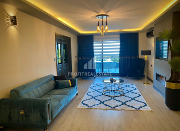 View design apartment 3 + 1 in a residence with a swimming pool 50m from the sea in the area of Mersin - Kargipinari ID-9286 фото-1}}