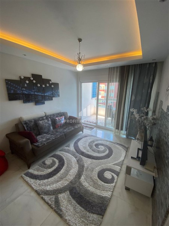 Меблированные двухкомнатные апартаменты, готовые в 300 метрах от пляжа Махмутлара, Аланья ID-9316 фото-1