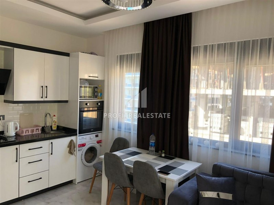Furnished one-bedroom apartment in a new residence with good facilities in Mahmutlar ID-9350 фото-2