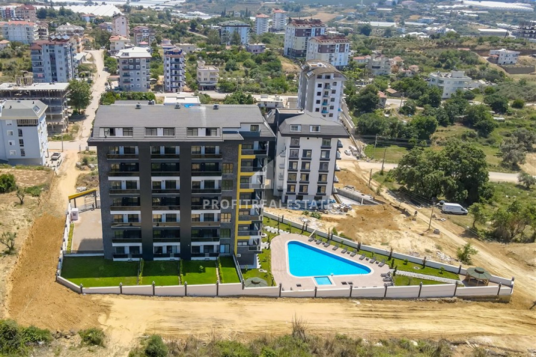 New apartment 1 + 1 with a private garden and swimming pool in a residence with good facilities in Avsallar ID-9359 фото-2