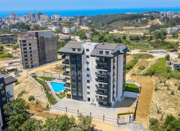 New apartment 1 + 1 with a private garden and swimming pool in a residence with good facilities in Avsallar ID-9359 фото-1