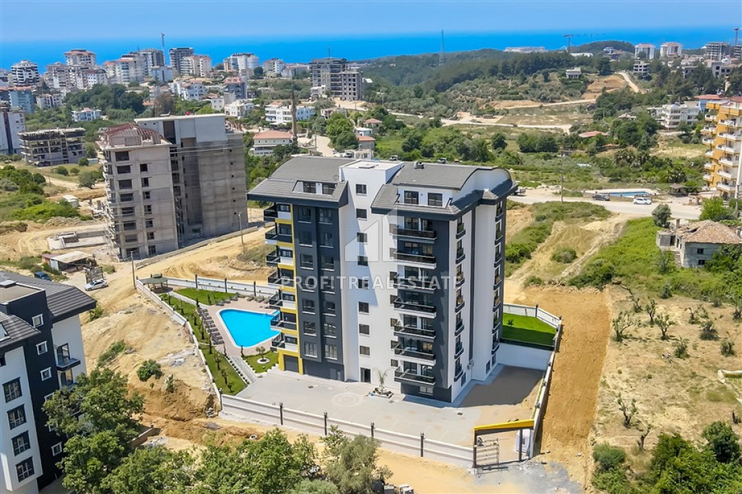 New apartment 1 + 1 with a private garden and swimming pool in a residence with good facilities in Avsallar ID-9359 фото-1