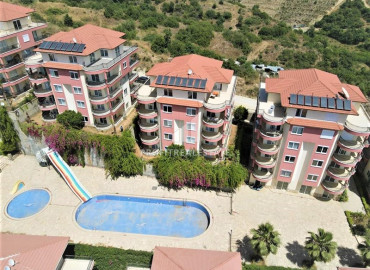 Large apartment 2 + 1 at a great price in a cozy residence on the slopes of the Taurus Mountains in Mahmutlar ID-9363 фото-1