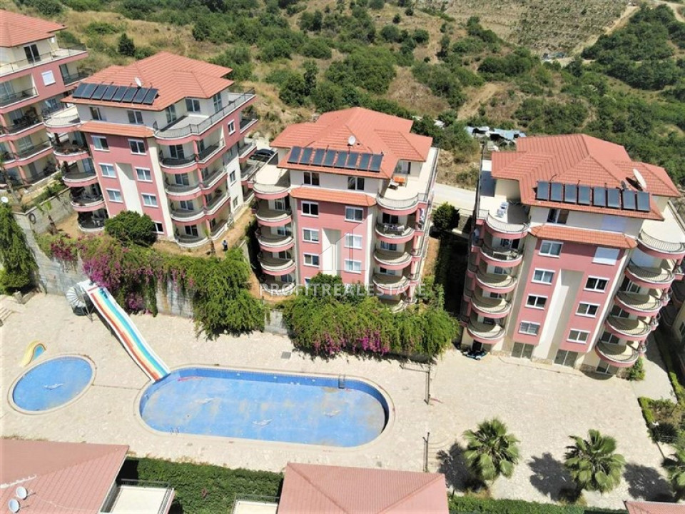 Large apartment 2 + 1 at a great price in a cozy residence on the slopes of the Taurus Mountains in Mahmutlar ID-9363 фото-1
