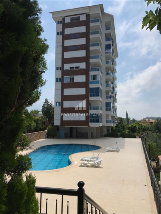 Furnished one-bedroom apartment with mountain views 800m from the sea in Alanya Tosmur ID-9270 фото-1