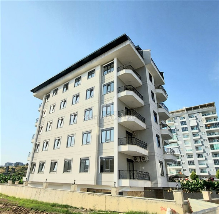 View duplex 3 + 1 in a new residence with a swimming pool, near the sea in Mahmutlar ID-9419 фото-1