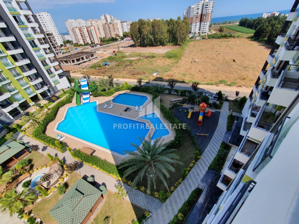New apartment 3 + 1 in Tece, Mersin, in a residence with extensive facilities, 500m from the sea ID-9506 фото-1
