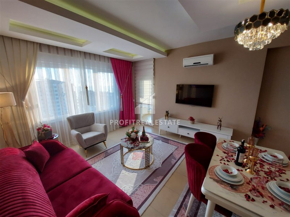 Two bedroom furnished apartment in a residence with a swimming pool, overlooking the sea in Mahmutlar ID-9511 фото-1