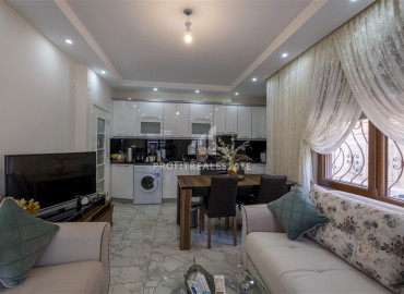 Furnished two-bedroom apartment in an urban building in the center of Alanya ID-9513 фото-3