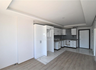 Квартира 1+1 с чистовой отделкой в новой резиденции в центре Мезитли, Мерсин ID-9605 фото-2