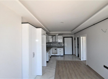 Квартира 1+1 с чистовой отделкой в новой резиденции в центре Мезитли, Мерсин ID-9605 фото-3