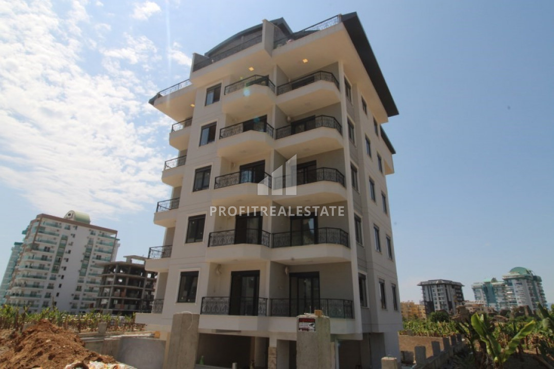 Двухкомнатная квартира в новой резиденции с бассейном в Махмутларе в 400м от побережья ID-9621 фото-1